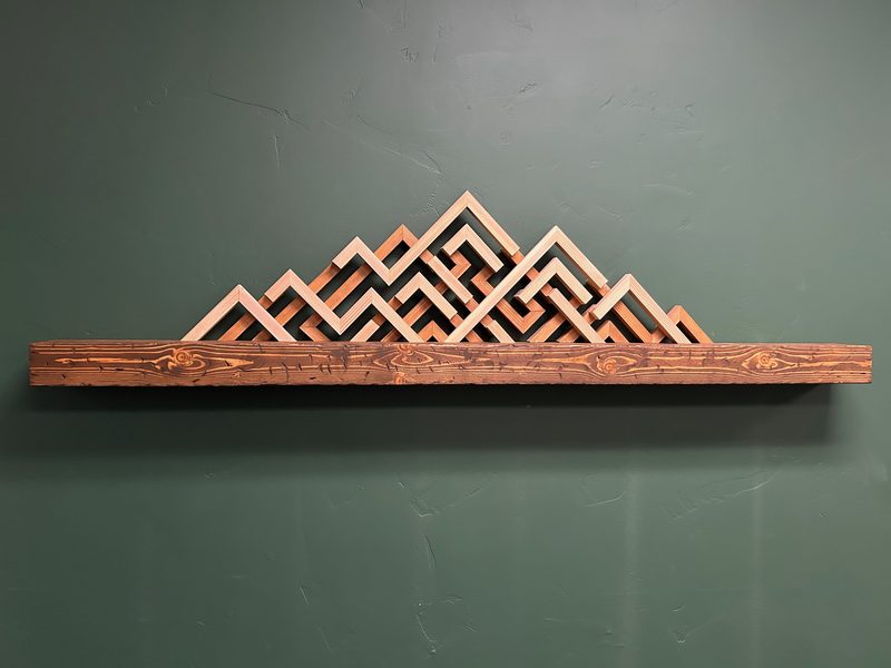 Handcrafted mountain range wood wall sculpture by PrimeWest Construction